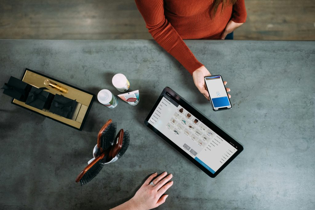 Image of a person paying with their smartphone.