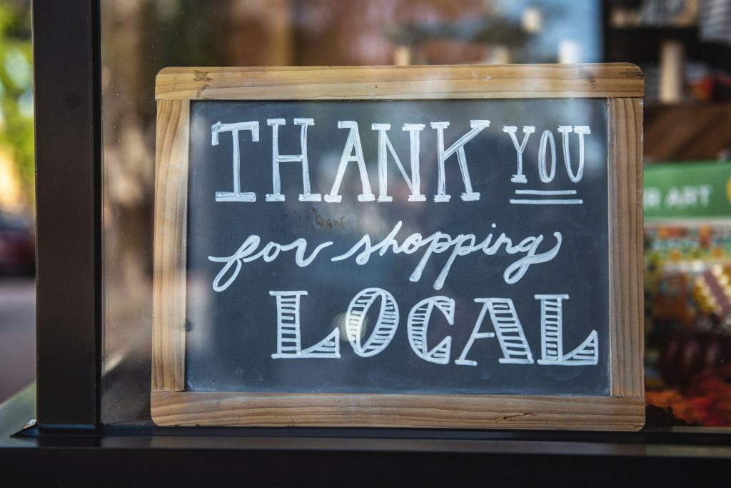 A photo of a sign that says, "Thank you for shopping local"